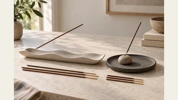 Long and compact incense holders compared with short and long incense sticks on a stone tabletop