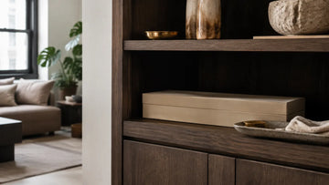 Closed incense storage box in a shaded shelf of a small city apartment