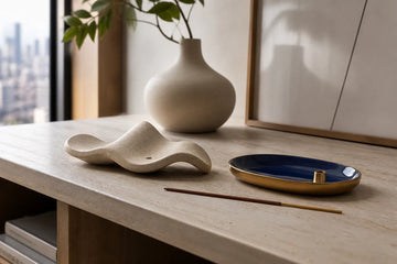 Concept comparison of ceramic and enamel incense holders on a compact shelf