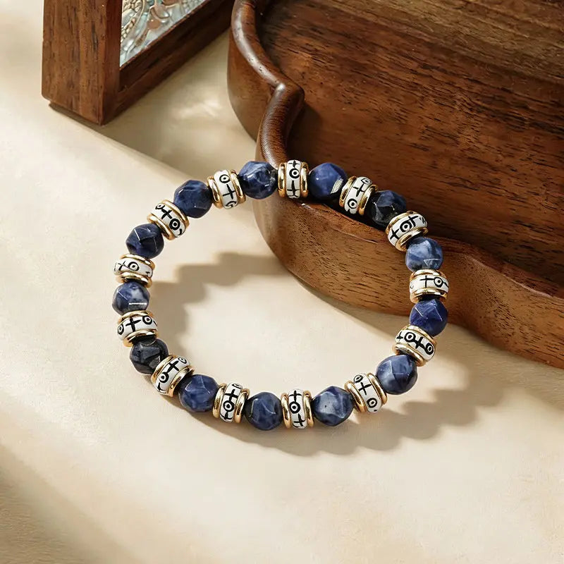 The Celestial Guardian - Tibetan Blue Sodalite & Carved Bovine Bone Bracelet ZANYÉ